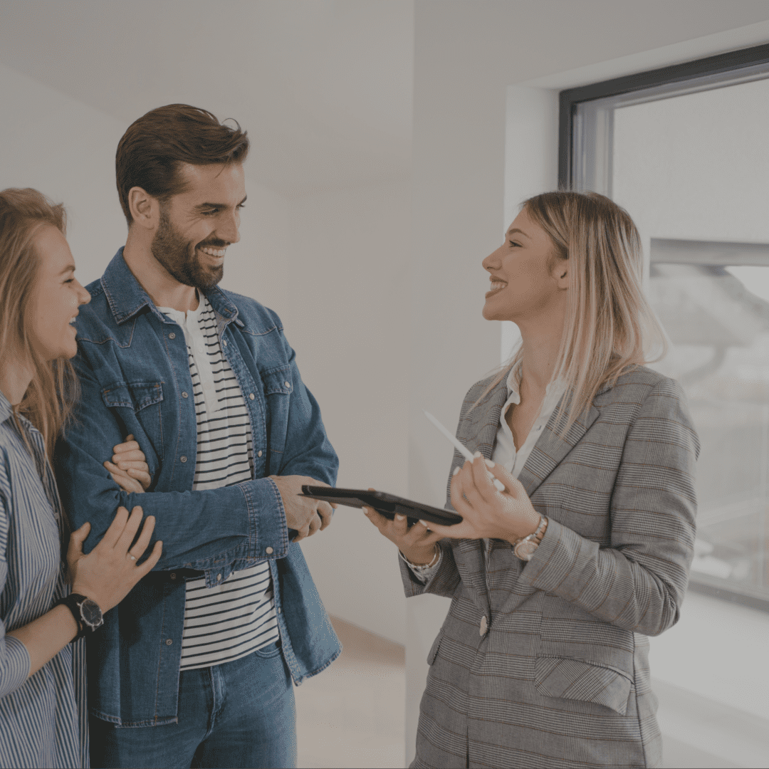 A group of people standing around each other.